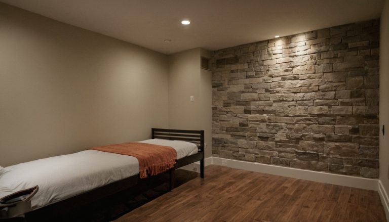 Which bedroom feature-wall finish best matches the room’s practical requirements shown in a luxury residential interior